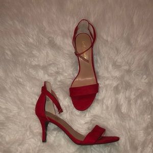 Red suede pumps